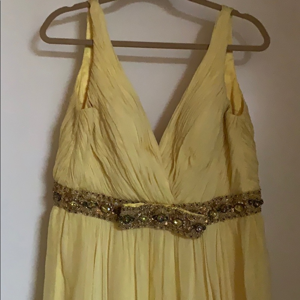 Yellow gown, worn but okay condition.